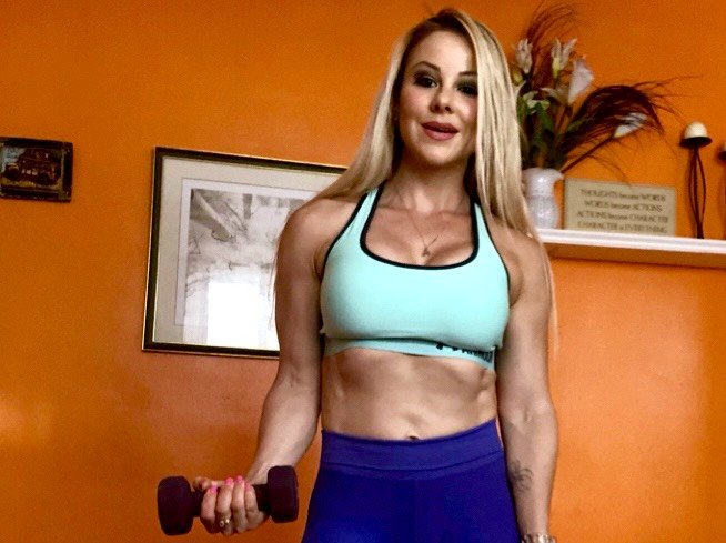 Adriana Albritton doing bicep curls at home